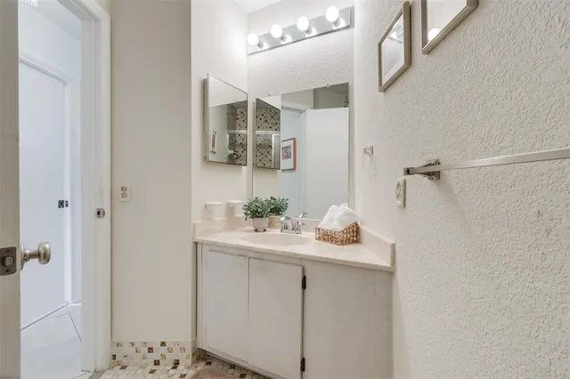 a view of a house with a small yard and plants