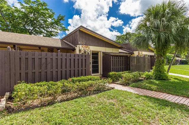 a view of a lake with houses in the back