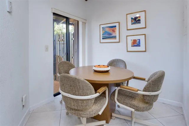 a kitchen with stainless steel appliances kitchen island granite countertop a refrigerator and microwave