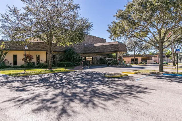 a view of a backyard with swimming pool