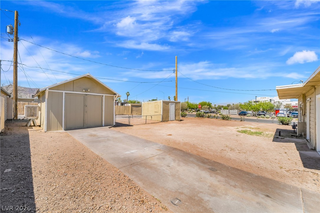 2 California Way Henderson, NV 89015 - Photo 25 of 29 A detached garage with ample space and a concrete driveway offers practical storage solutions.