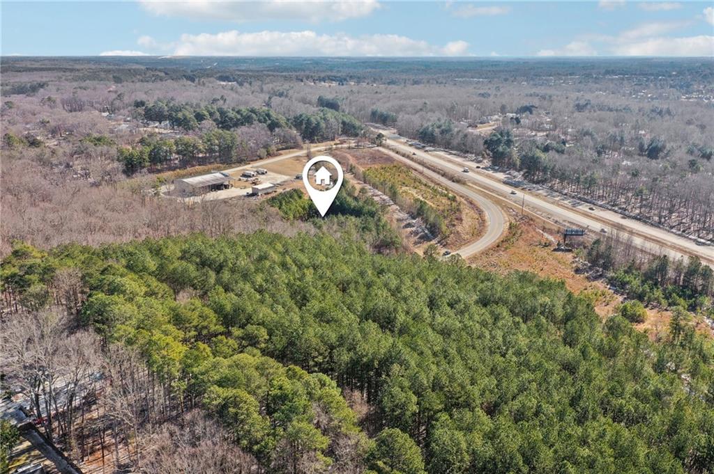 762 Harbins Road Dacula, GA 30019 - Photo 13 of 18 a view of a dry yard with wooden fence
