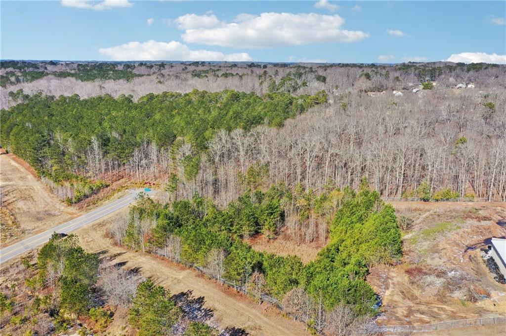 762 Harbins Road Dacula, GA 30019 - Photo 14 of 18 a view of a lake with mountains in the background