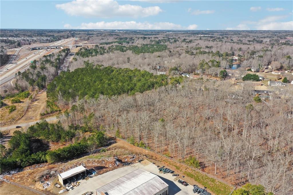 762 Harbins Road Dacula, GA 30019 - Photo 6 of 18 an aerial view of a house with a yard