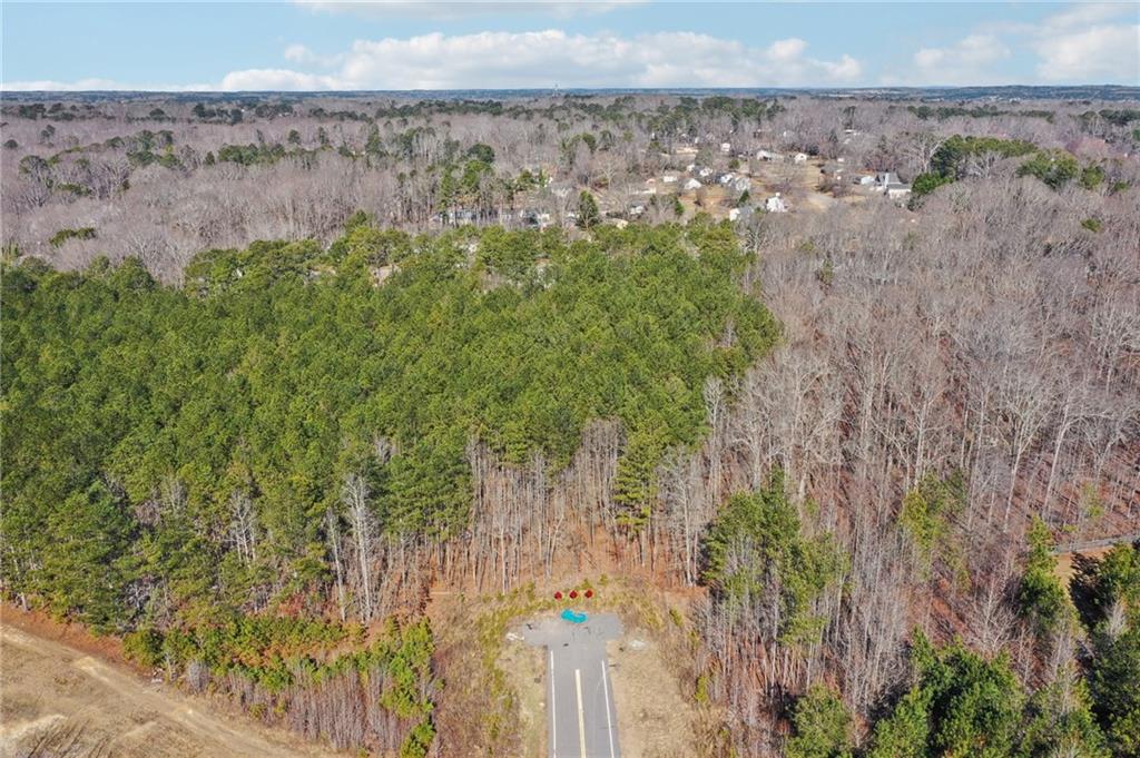 762 Harbins Road Dacula, GA 30019 - Photo 7 of 18 a view of a yard with an outdoor space