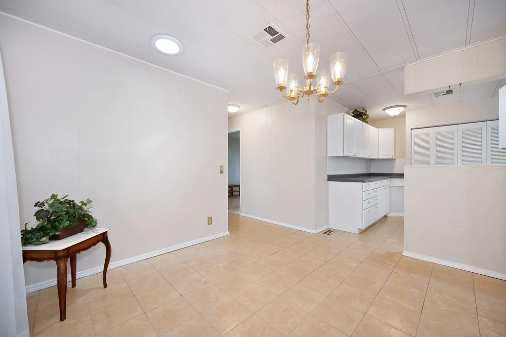 6374 Brodie Drive Newcastle, CA 95658 - Photo 12 of 50 a view of an empty room with kitchen and a window