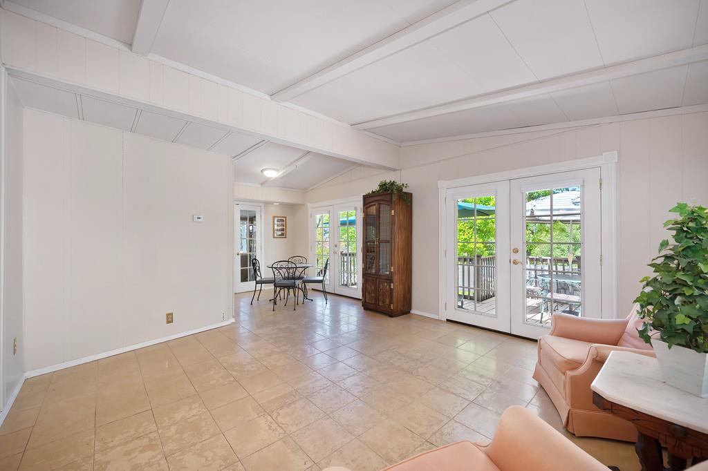 6374 Brodie Drive Newcastle, CA 95658 - Photo 13 of 50 a view of a livingroom with furniture and floor to ceiling window