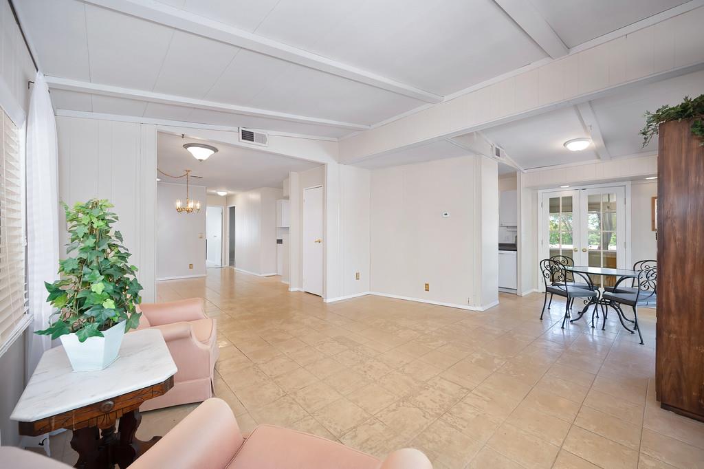 6374 Brodie Drive Newcastle, CA 95658 - Photo 15 of 50 a living room with furniture and a potted plant