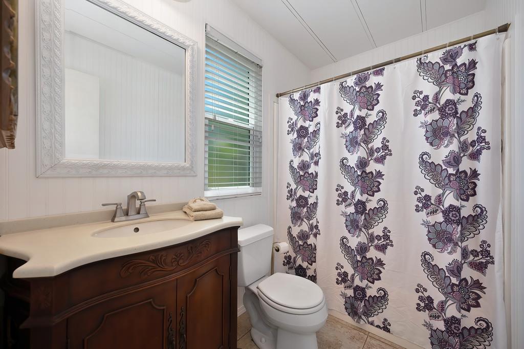 6374 Brodie Drive Newcastle, CA 95658 - Photo 26 of 50 a bathroom with a sink toilet and a mirror