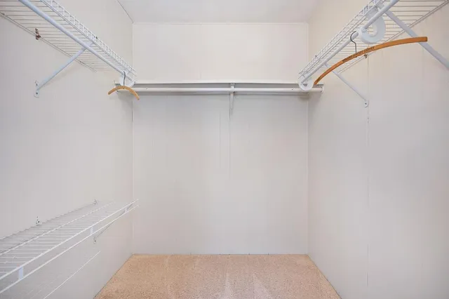a view of an empty walk in closet