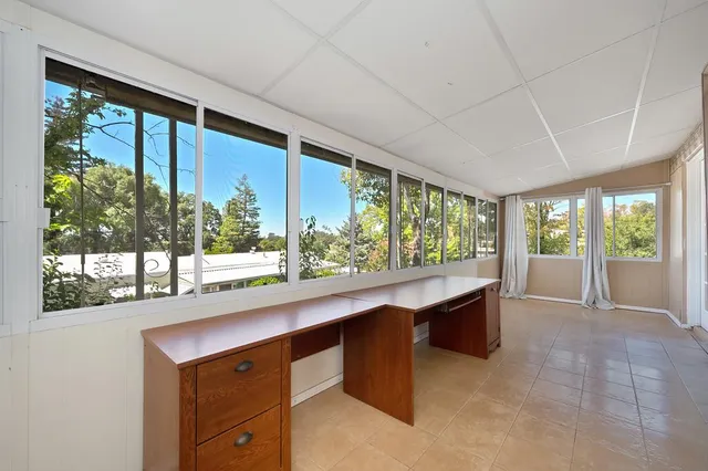 a view of a patio with couches and potted plants