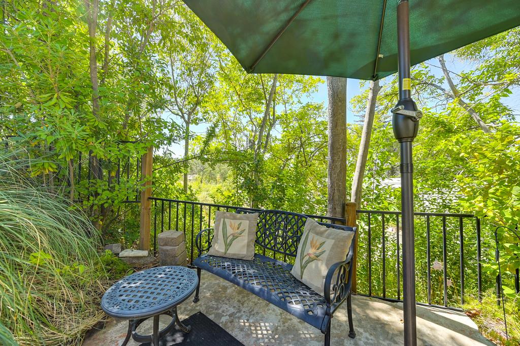 6374 Brodie Drive Newcastle, CA 95658 - Photo 49 of 50 a view of a chair and table in patio with wooden fence