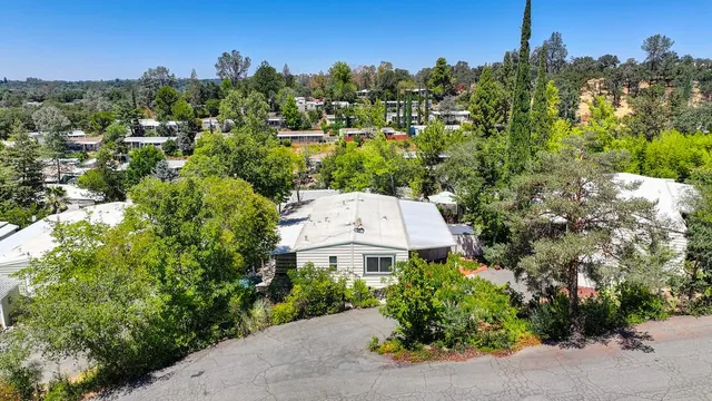 an aerial view of a house with a garden