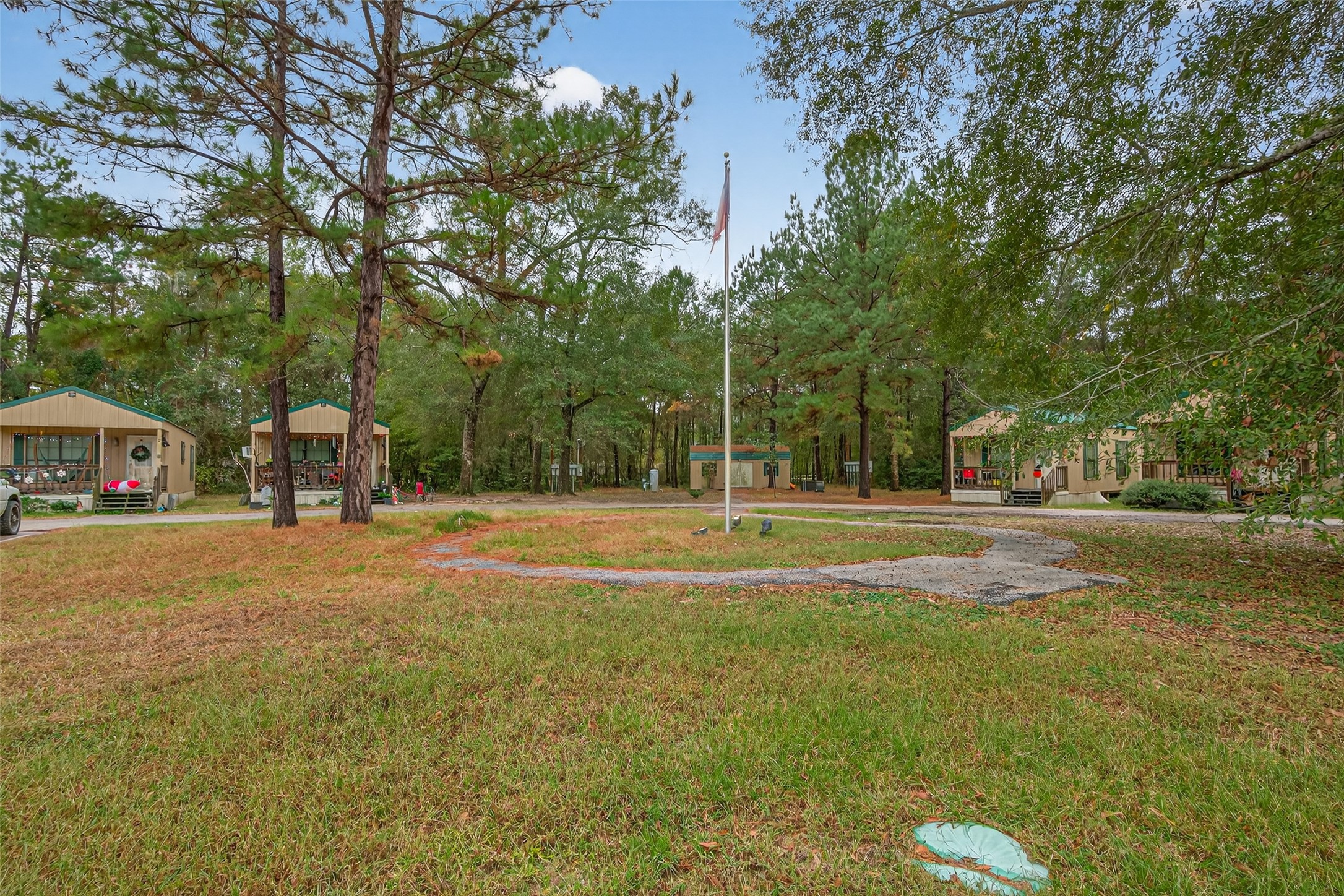 11497 Coon Hollow Road Conroe, TX 77306 - Photo 17 of 45 a view of a house with a yard