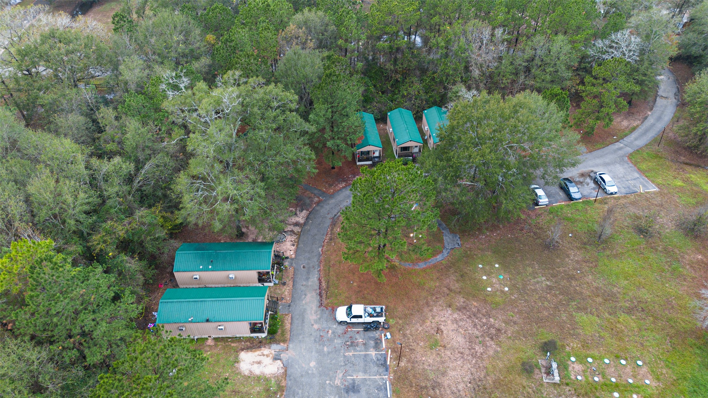 11497 Coon Hollow Road Conroe, TX 77306 - Photo 30 of 45 an aerial view of a house with a yard