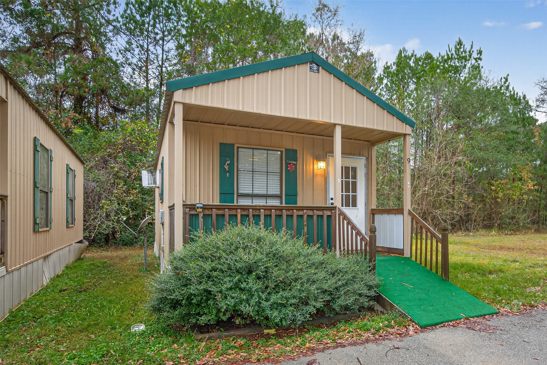 11497 Coon Hollow Road Conroe, TX 77306 - Photo 3 of 45 a view of a house with backyard and garden
