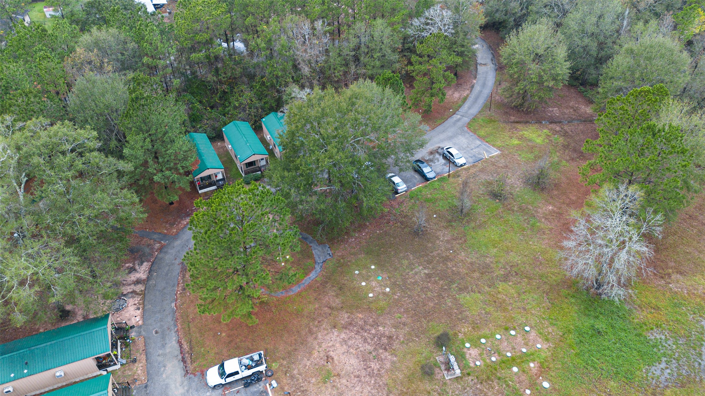 11497 Coon Hollow Road Conroe, TX 77306 - Photo 31 of 45 an aerial view of a house with a yard