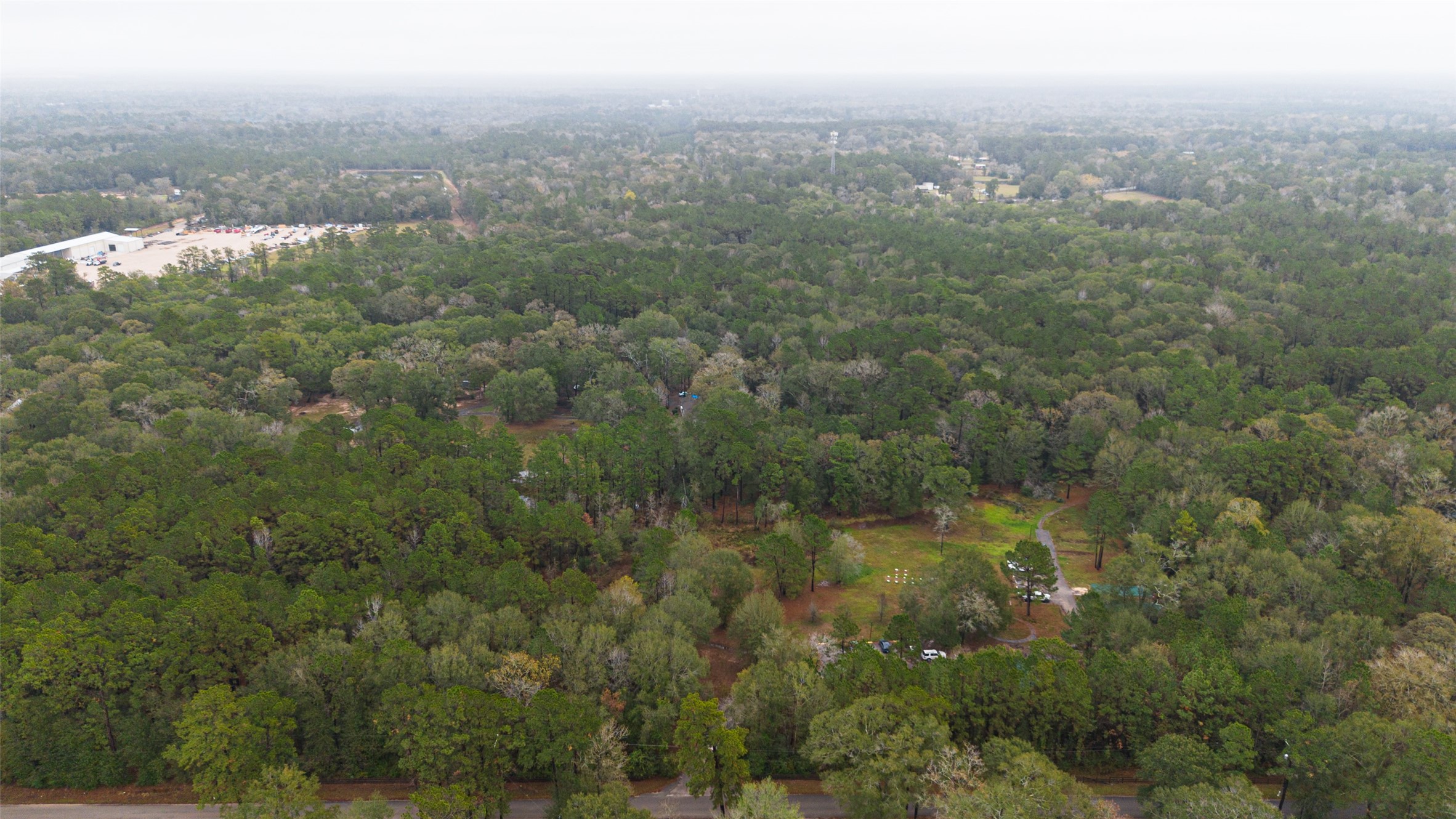 11497 Coon Hollow Road Conroe, TX 77306 - Photo 34 of 45 a view of a city with lush green forest