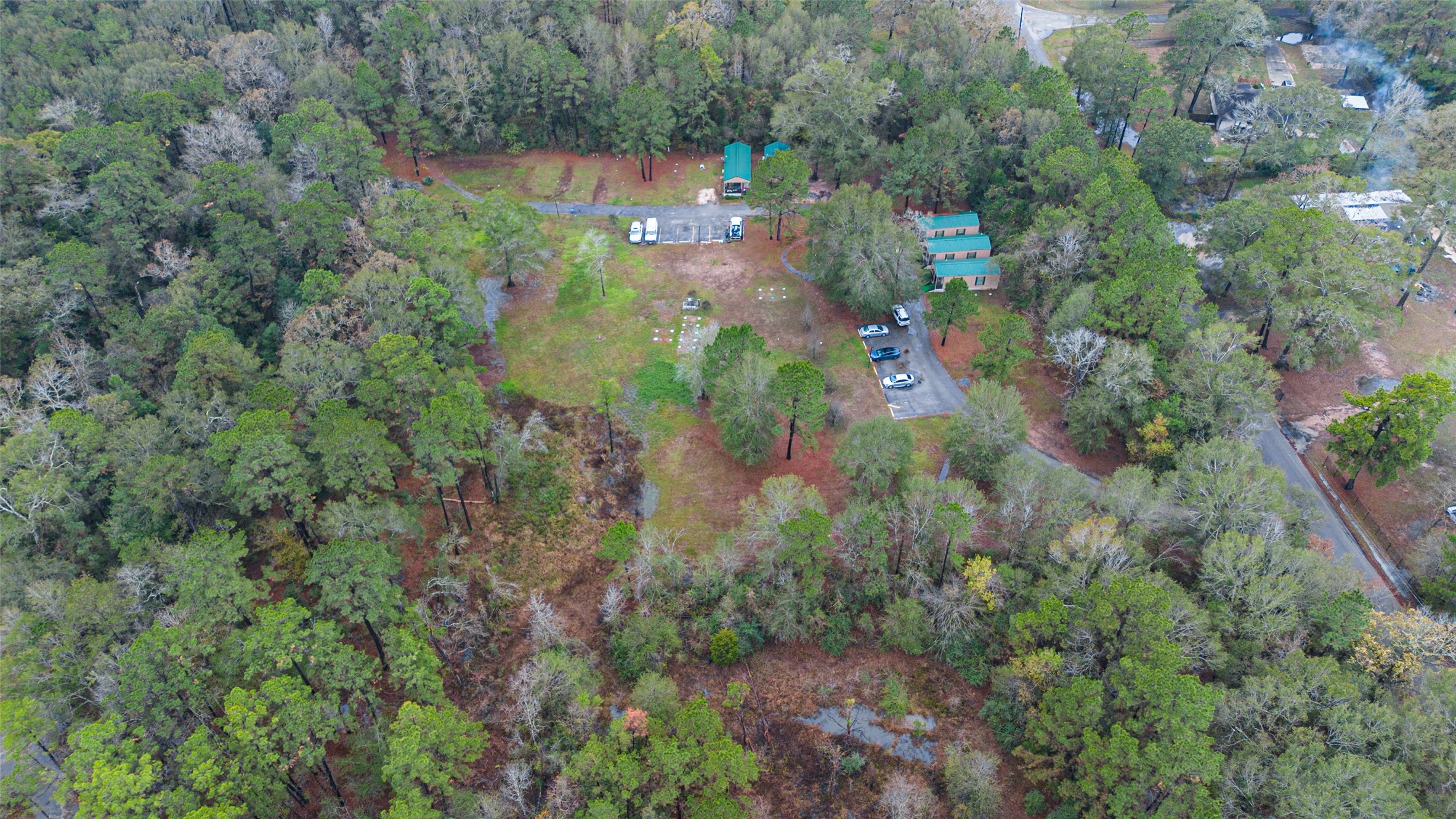 11497 Coon Hollow Road Conroe, TX 77306 - Photo 42 of 45 an aerial view of residential house with outdoor space and trees all around