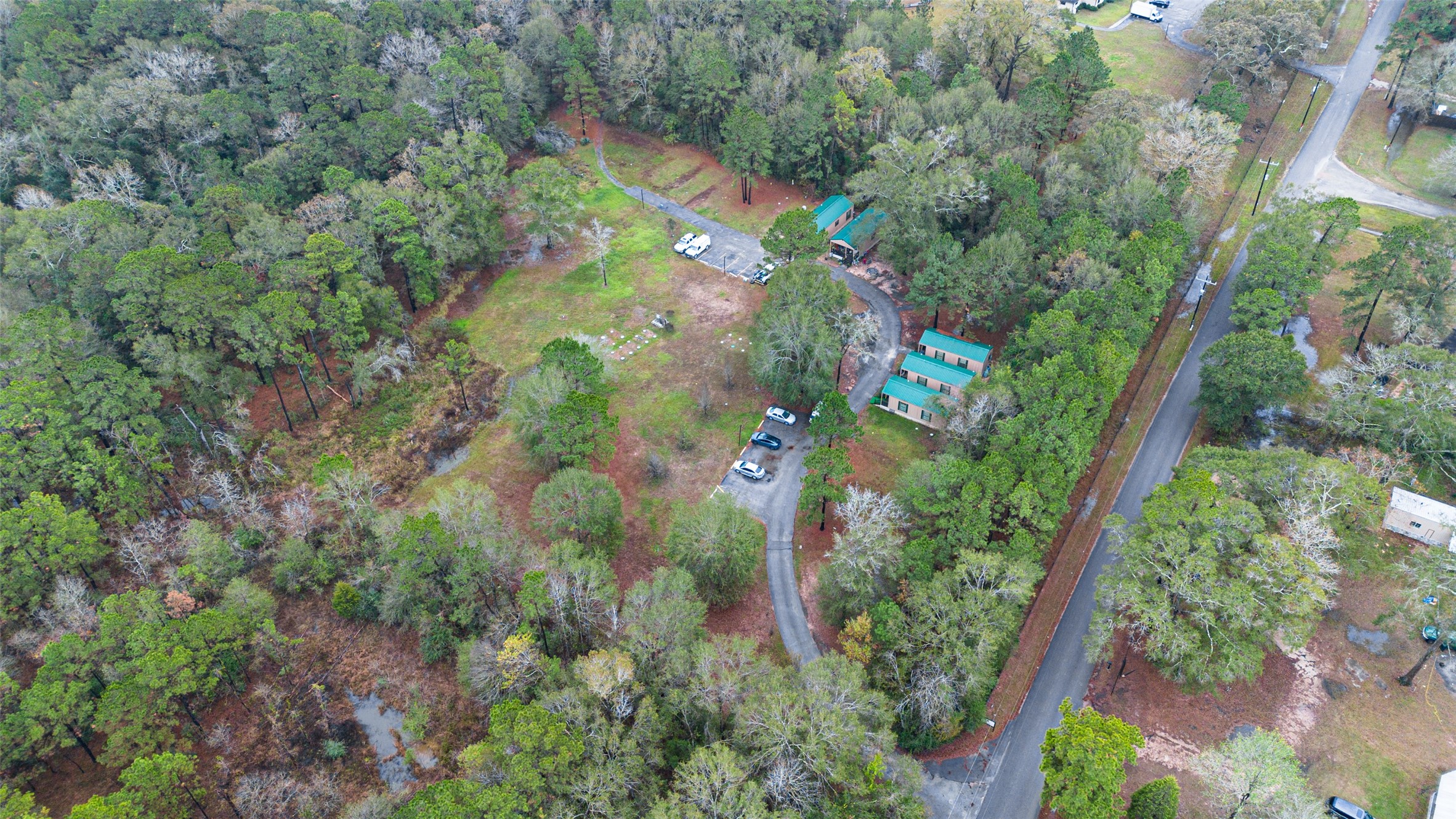 11497 Coon Hollow Road Conroe, TX 77306 - Photo 43 of 45 an aerial view of a houses with outdoor space and street view