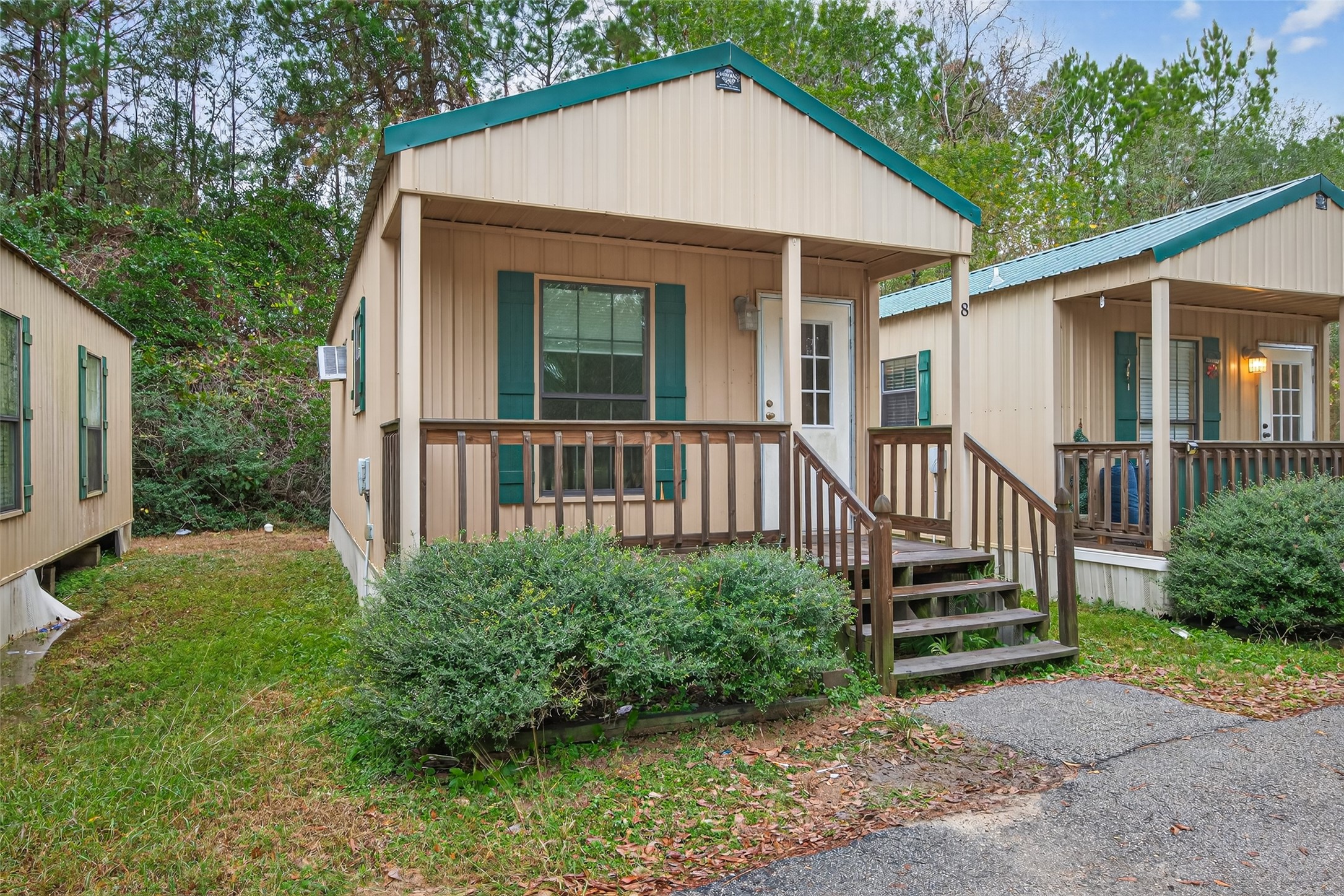 11497 Coon Hollow Road Conroe, TX 77306 - Photo 6 of 45 a view of a house with a yard and deck