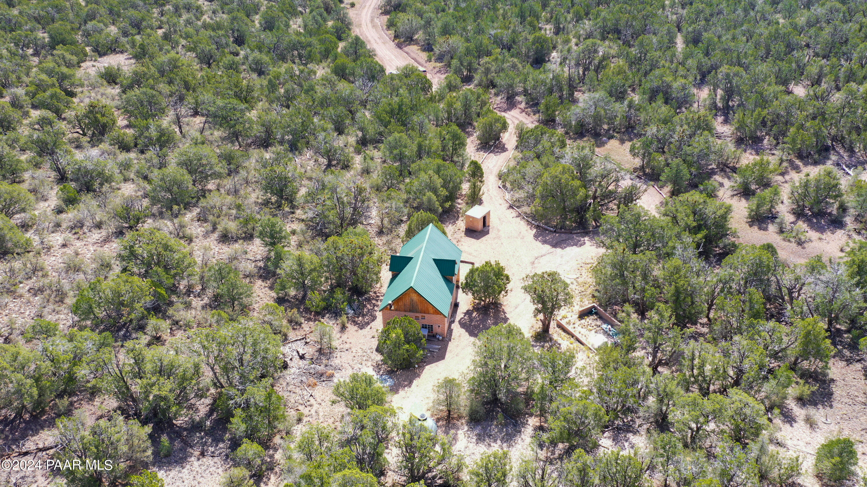 887 North Whiskey Way Seligman, AZ 86337 - Photo 23 of 36 an aerial view of residential house with outdoor space and trees