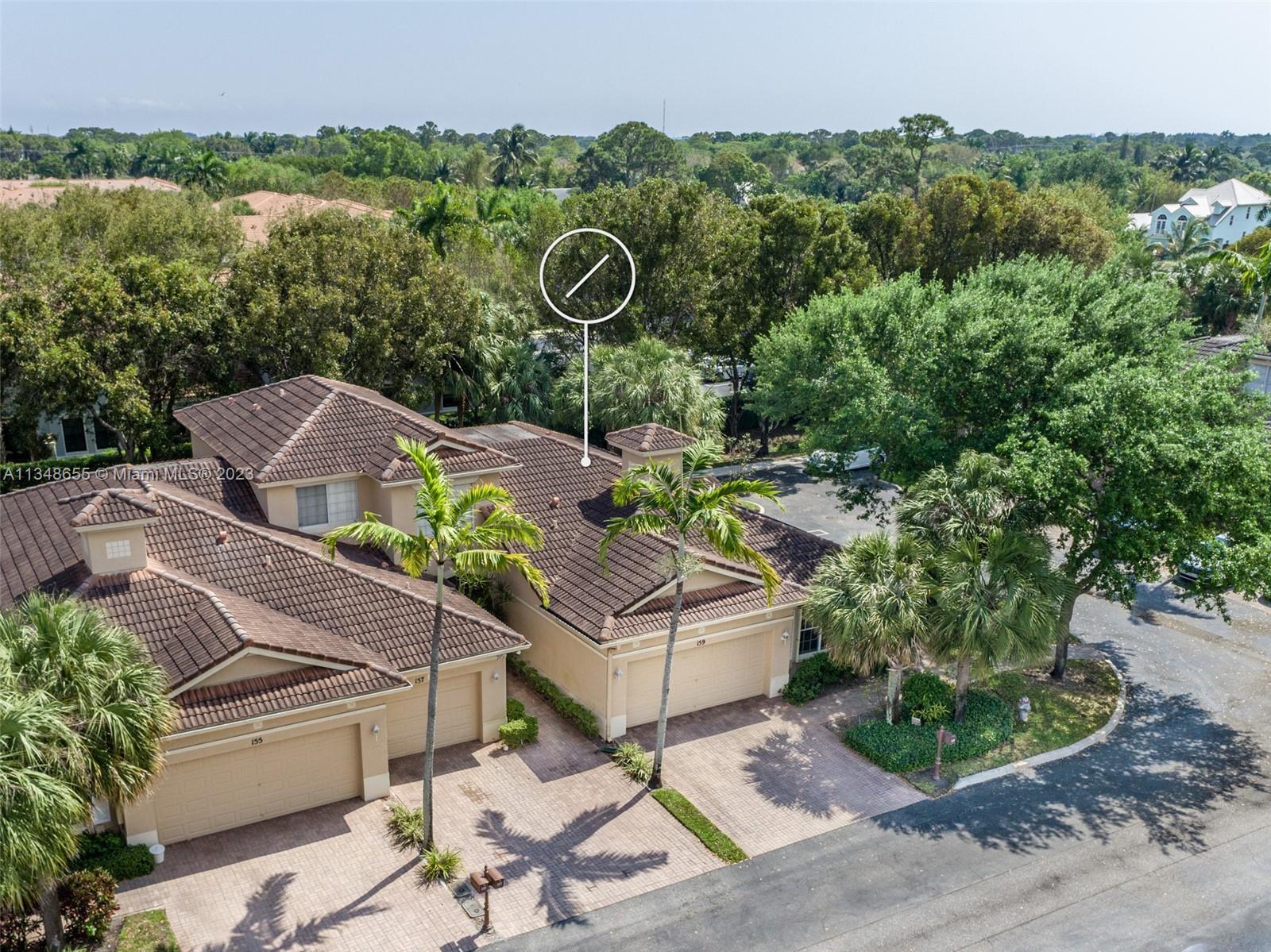 159 Coconut Key Lane Delray Beach, FL 33484 - Photo 4 of 29 an aerial view of a house with garden space and trees