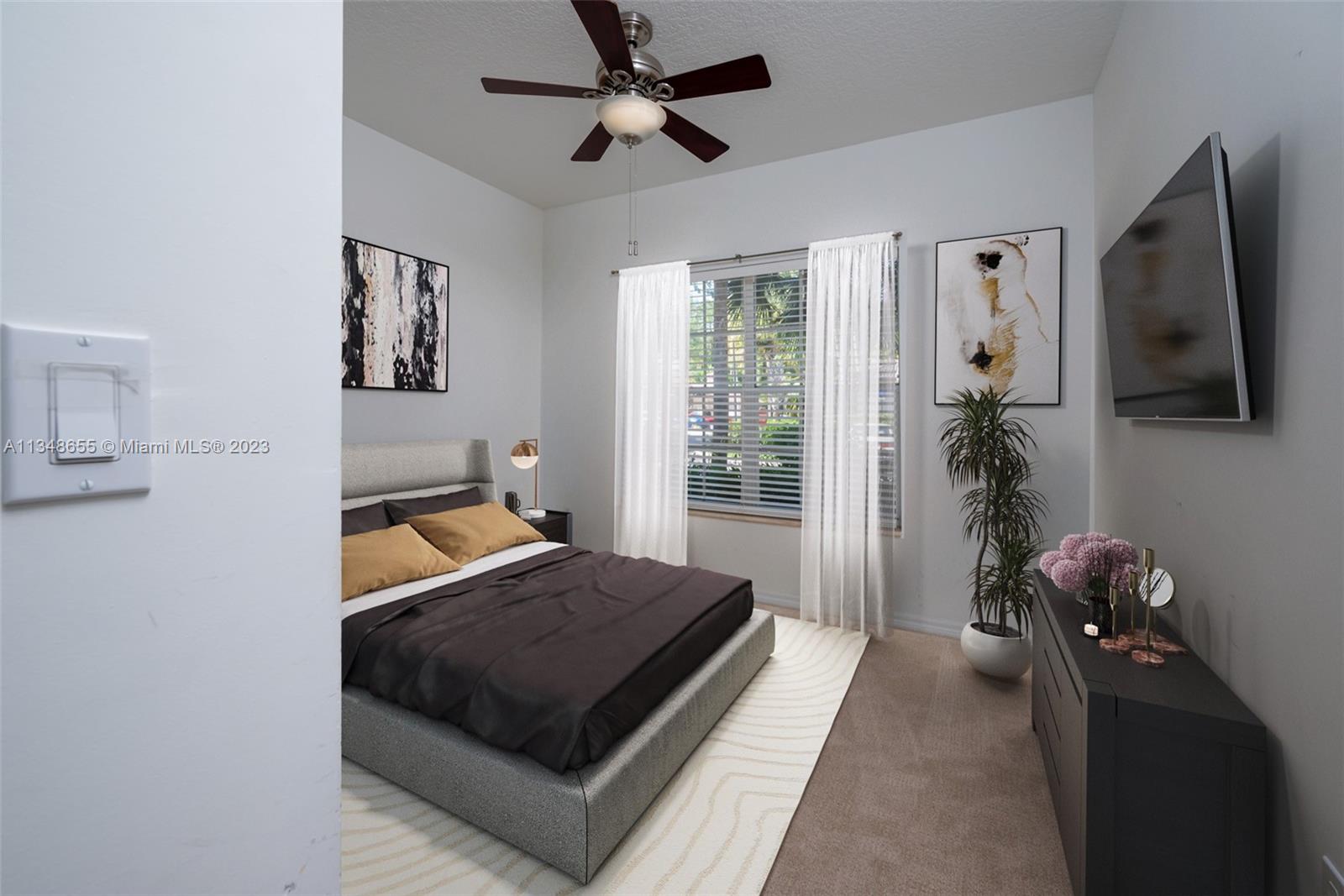 159 Coconut Key Lane Delray Beach, FL 33484 - Photo 8 of 29 a room with furniture and a flat screen tv