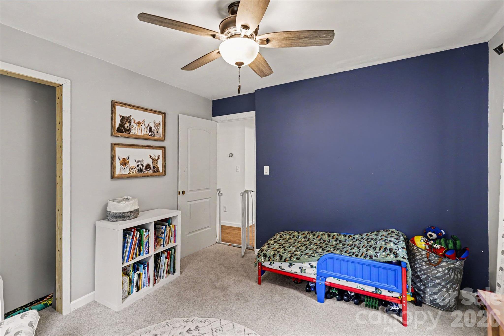 184 Canal Road Belmont, NC 28012 - Photo 37 of 39 a bedroom with furniture and a book shelf