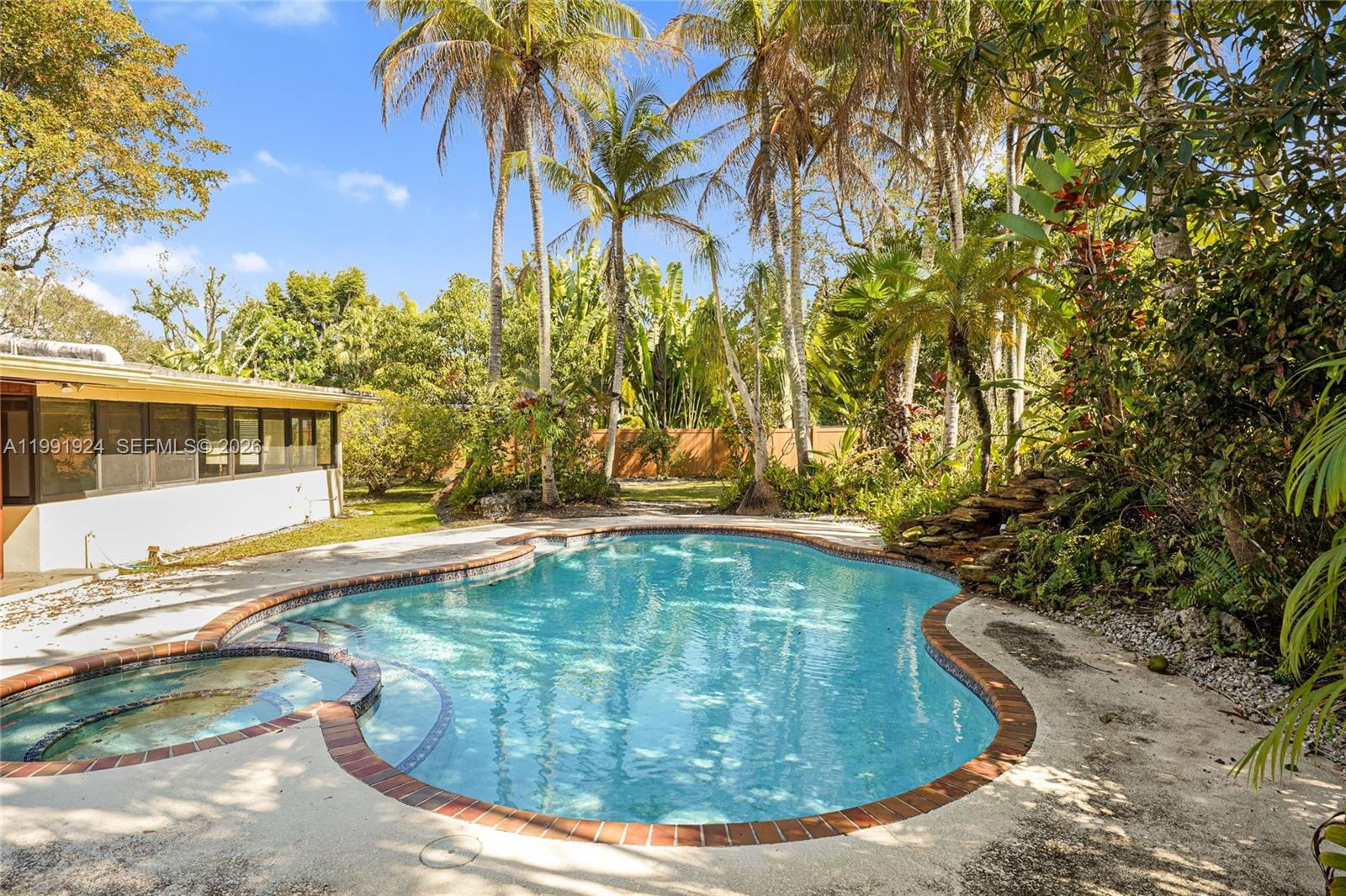 8250 Southwest 95th Street Miami, FL 33156 - Photo 11 of 21 a view of a swimming pool with a yard