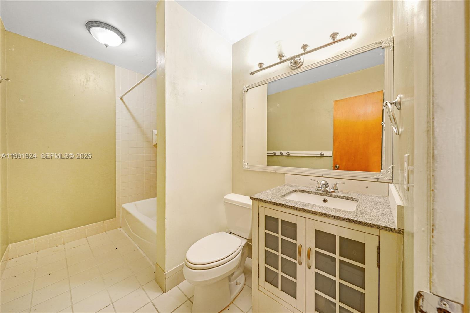 8250 Southwest 95th Street Miami, FL 33156 - Photo 15 of 21 a bathroom with a granite countertop sink toilet and shower