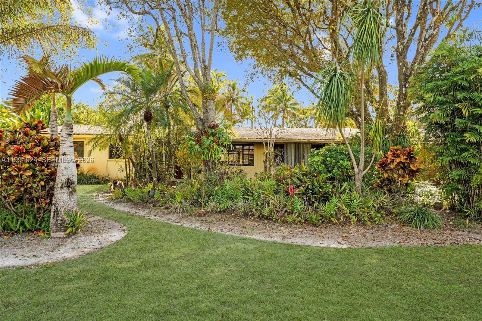 8250 Southwest 95th Street Miami, FL 33156 - Photo 19 of 21 a view of a garden with a tree