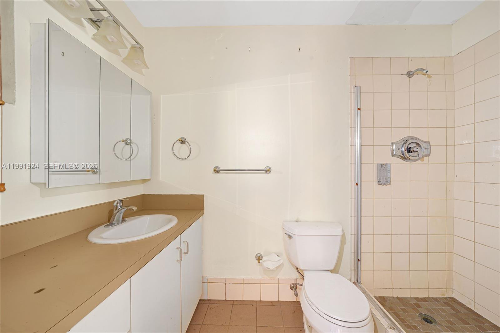 8250 Southwest 95th Street Miami, FL 33156 - Photo 7 of 21 a bathroom with a sink a toilet and shower