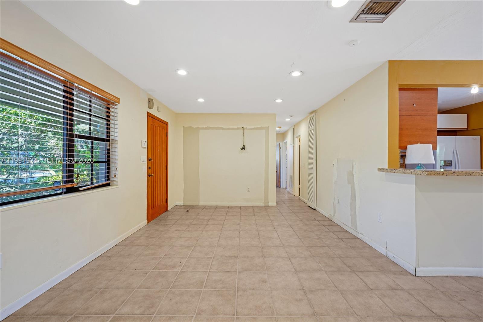 8250 Southwest 95th Street Miami, FL 33156 - Photo 9 of 21 a view of an empty room with a window