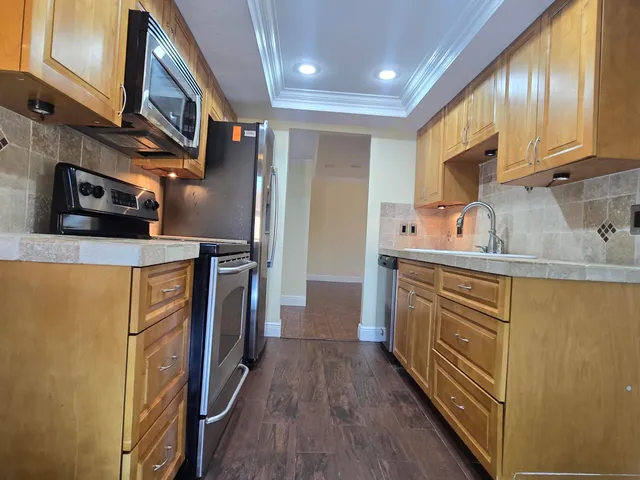 a kitchen with a stove microwave and refrigerator