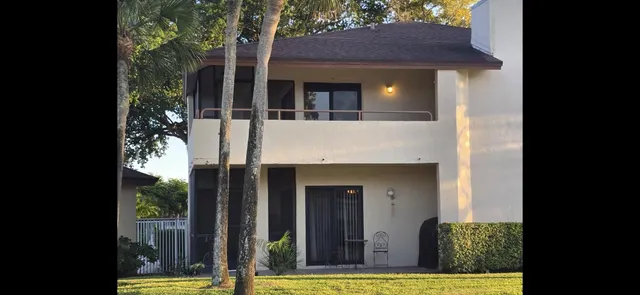 a kitchen that has a sink a refrigerator and window