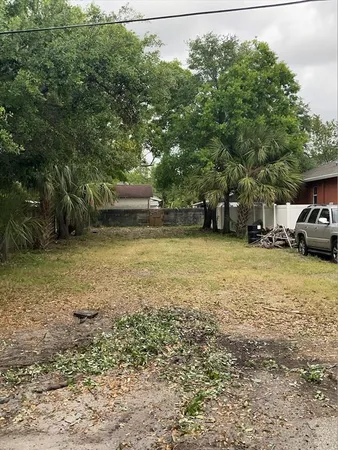 a view of a street with a car parked in front of it