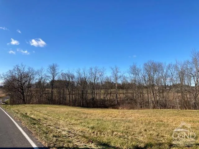 a view of an ocean beach and a mountain