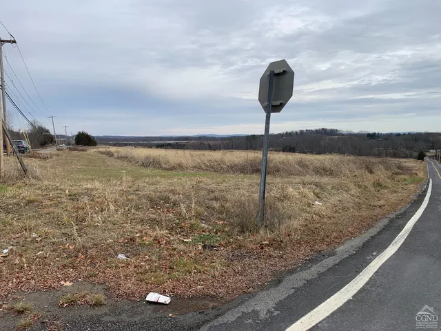 a view of an ocean beach and mountain