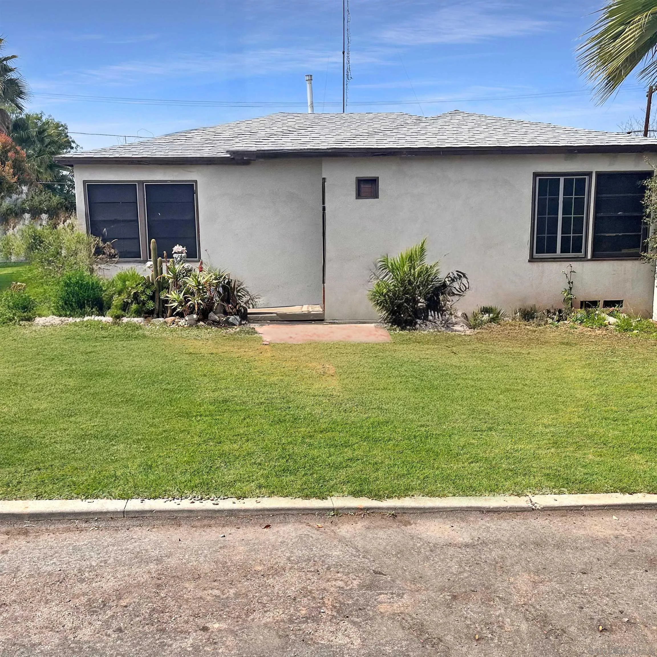 a view of backyard with seating space