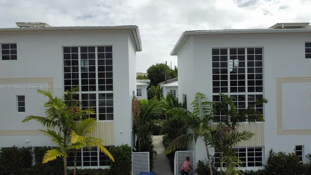 a view of a building with a yard