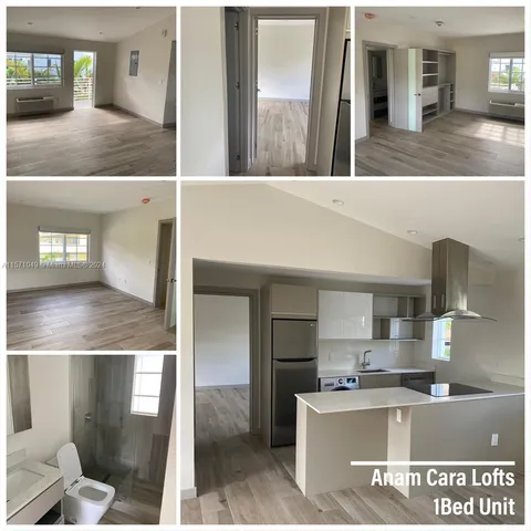 a view of kitchen with kitchen island a sink appliances and cabinets
