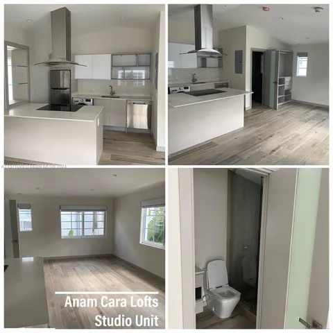 a kitchen with kitchen island a counter top space a sink and appliances