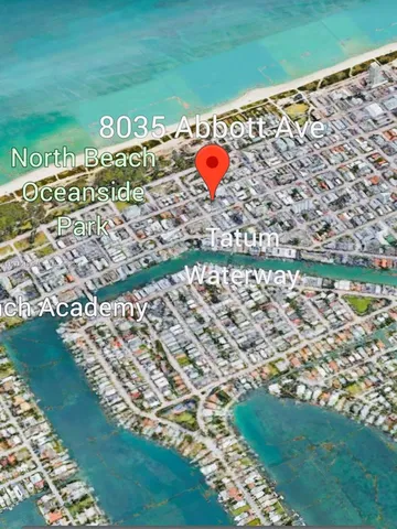 a kitchen with a refrigerator and a sink