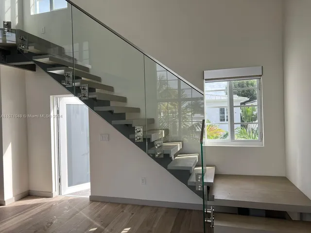 a bathroom with a shower and a sink