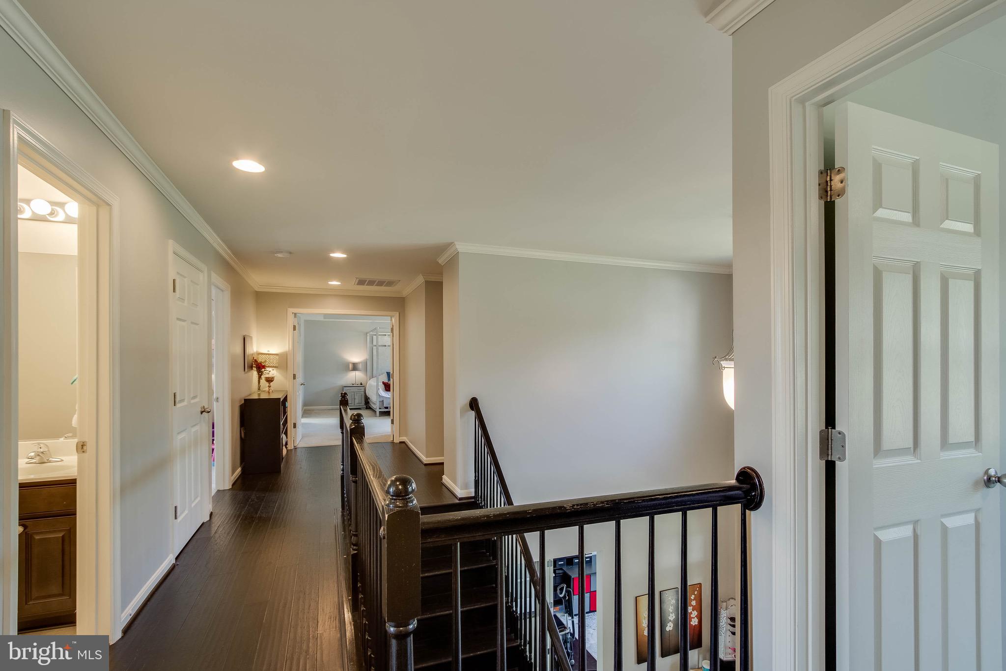 5952 Hunter Crest Road Woodbridge, VA 22193 - Photo 35 of 44 Upstairs Hallway with hardwood flooring