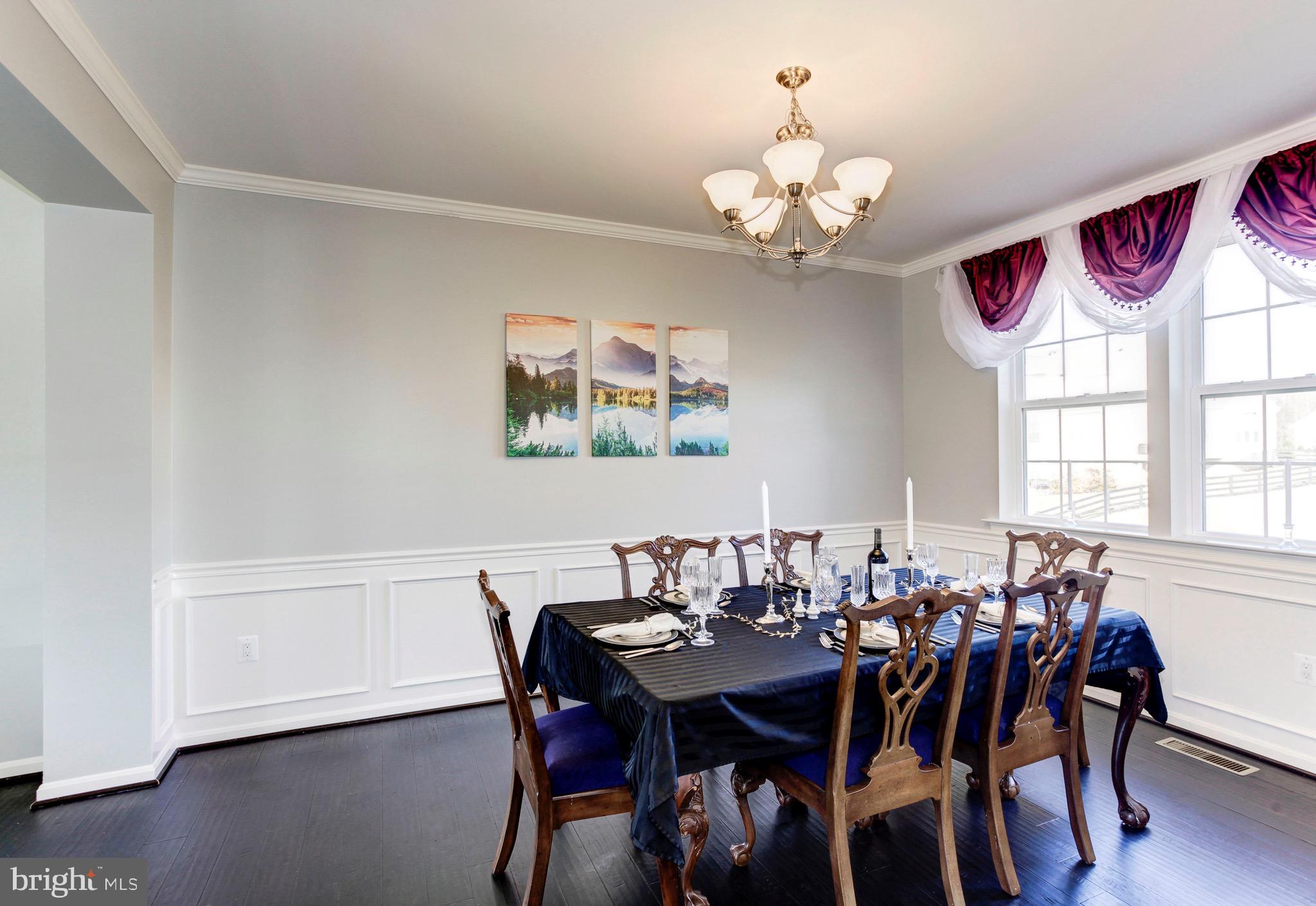 5952 Hunter Crest Road Woodbridge, VA 22193 - Photo 5 of 44 Dining Room with crown molding and chair railing