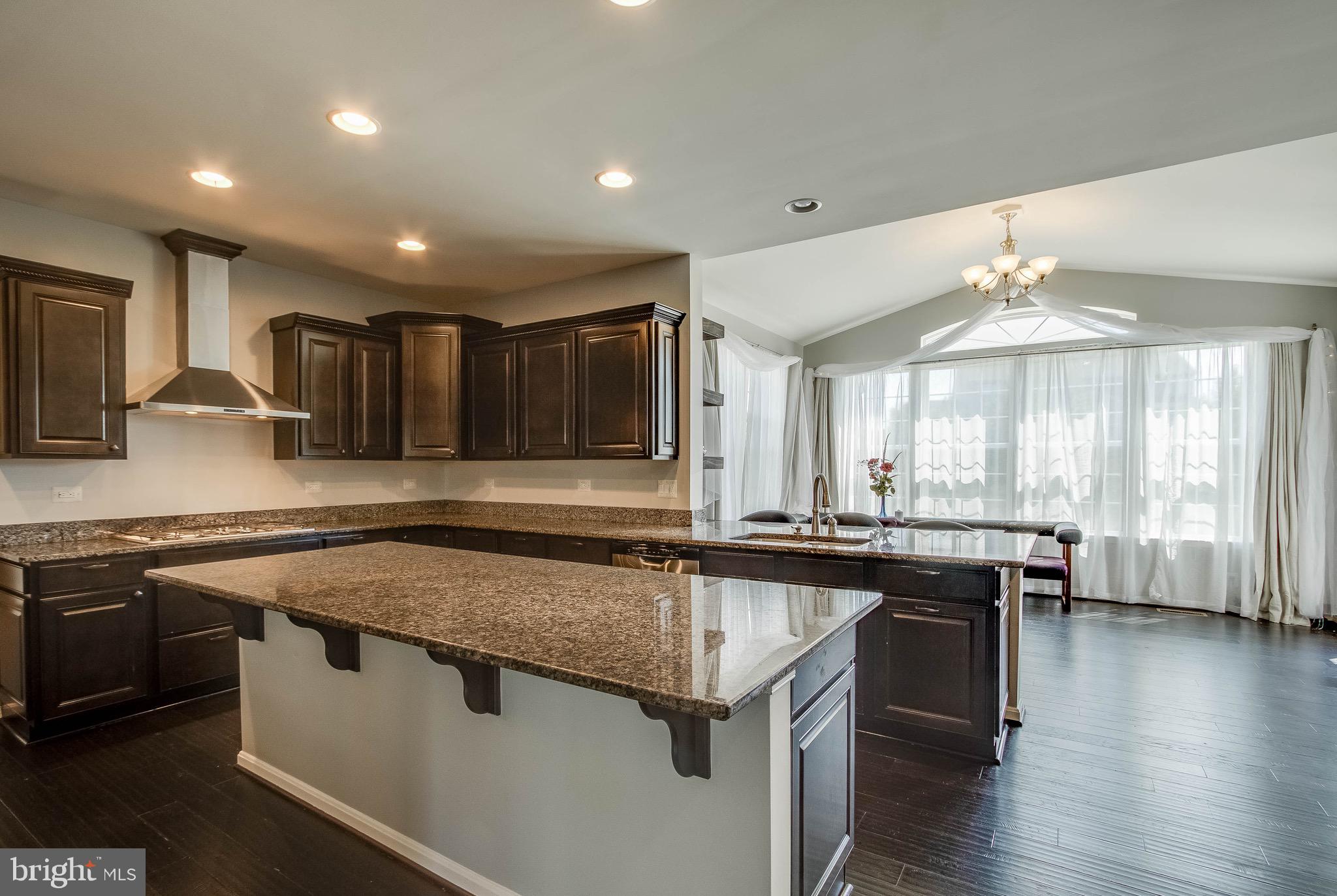 5952 Hunter Crest Road Woodbridge, VA 22193 - Photo 8 of 44 Kitchen with stainless steel stove top and hood