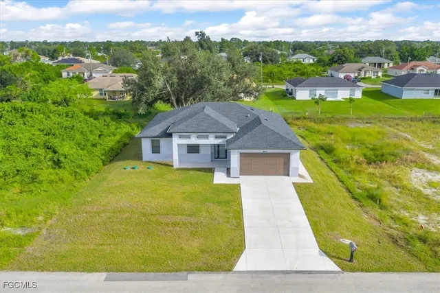 a view of house with a garden