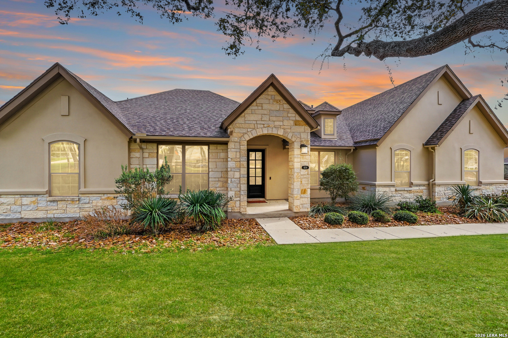 a front view of a house with garden